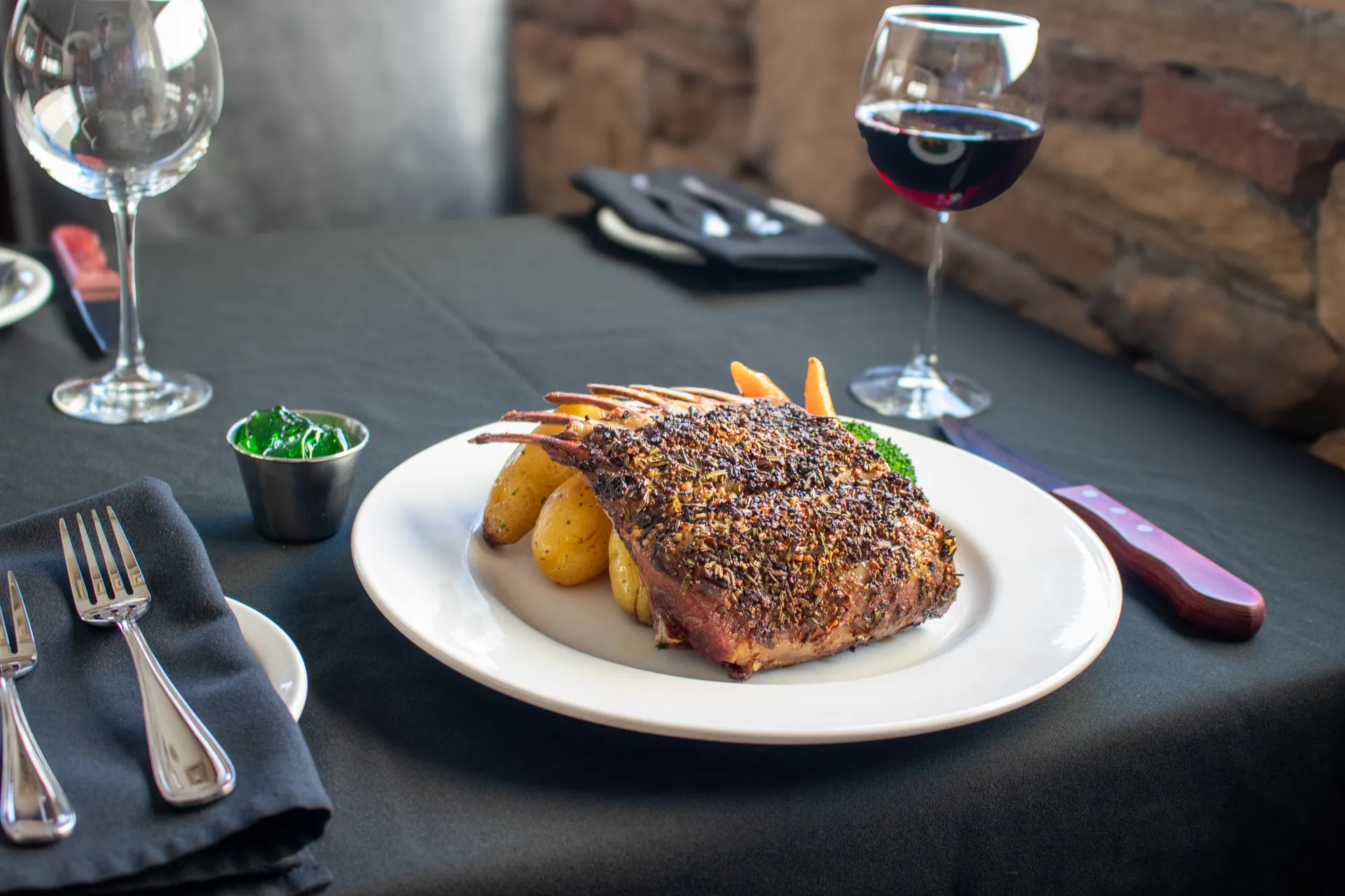 Herb-crusted Rack of Lamb served with seasonal vegetables